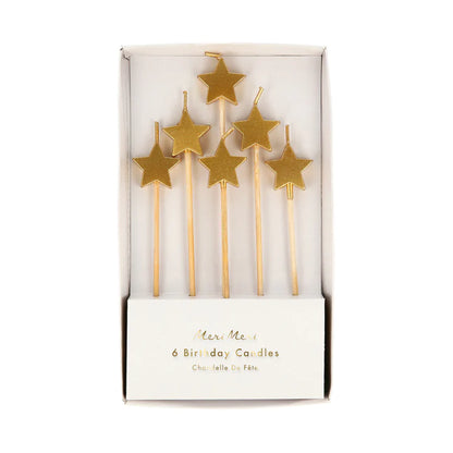 Velas pequeñas con forma de estrella dorada