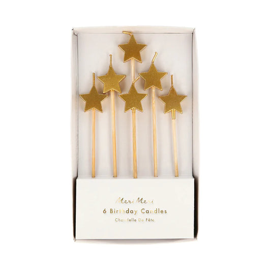 Velas pequeñas con forma de estrella dorada